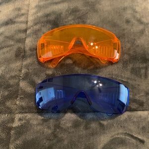 Orange and blue unisex cycling glasses, new with tags.